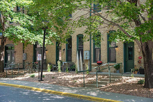 Exterior of FreightYard Townhomes and Flats featuring private walk up entrances.