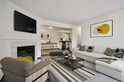Furnished Living Room with Large Couch, Coffee Table and TV