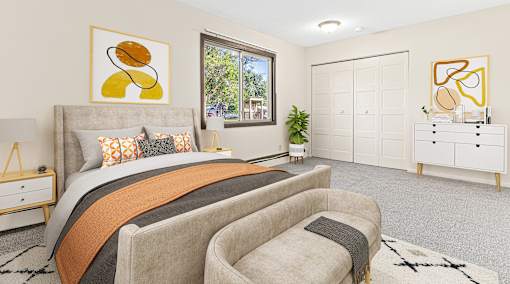 a bedroom with a bed and a chair