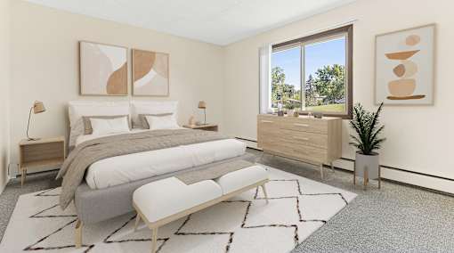 a bedroom with a bed and a large window
