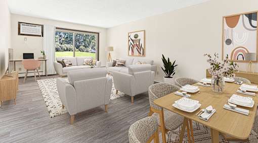 a living room and dining room with couches and chairs and a table