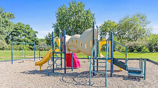 a playground with a slide and other play equipment