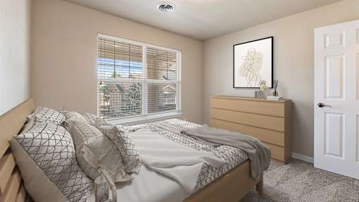 an empty bedroom with a bed and a window