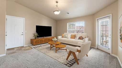 a living room with a couch and a tv