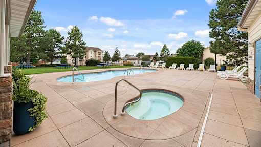 our apartments have a resort style pool and spa with chaise lounge chairs