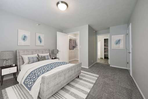 Large bedroom with spacious walk in closet and space to spare.