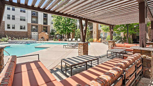 our apartments have a resort style pool and lounge furniture