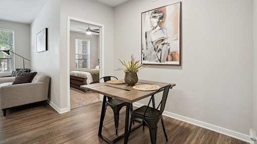 an open living room and dining room with a table and chairs