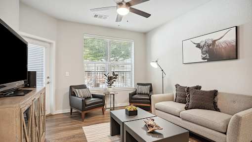 an open living room with a couch and a tv