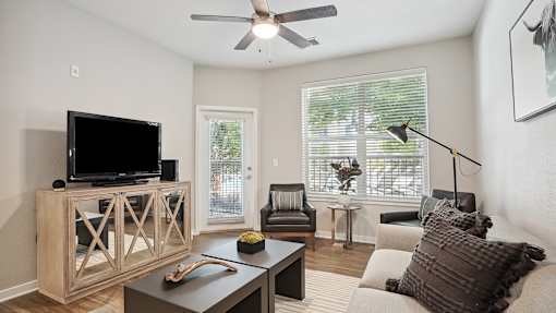 a living room with a couch and a tv