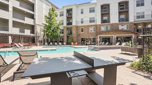 our apartments have a resort style pool and community table
