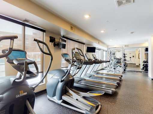 Fitness center with hard rubber flooring, 3 treadmills and 2 ellipticals