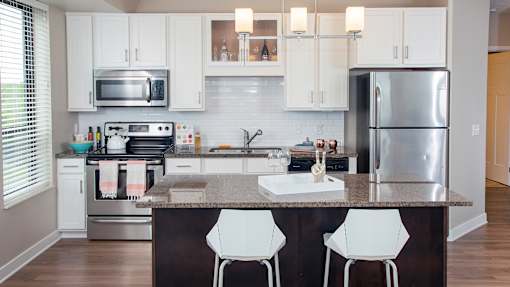a kitchen with stainless steel appliances and a granite counter top