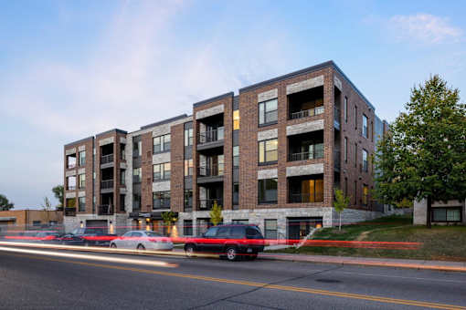 Exterior view of Elements on Linden Hill, three cars parked on near street entrance