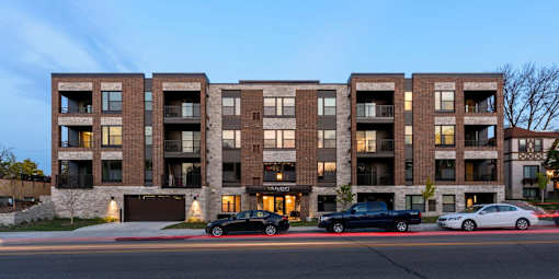 Exterior view of Elements on Linden Hill, three cars parked on near street entrance