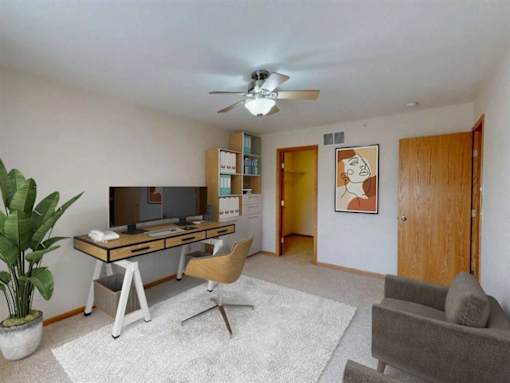 Guest room converted into a work from home office. Space is filled with natural light  and plenty of space for storage or decor.