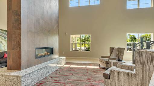 a living room with couches and a fireplace