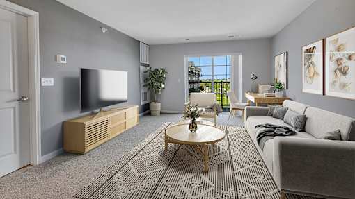 an open living room with a couch and a table