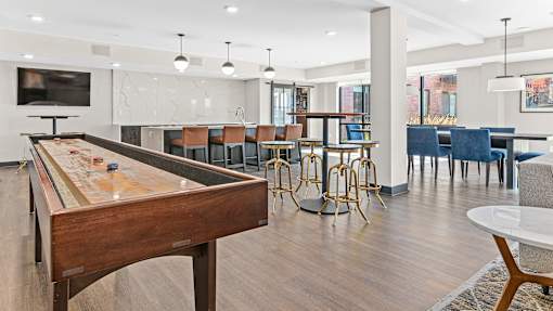 a game room with a pool table and a bar