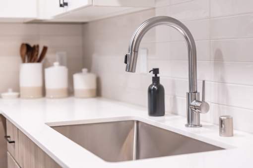 a kitchen sink and faucet in a 555 waverly unit