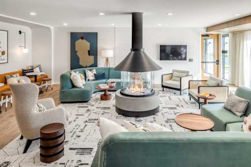 a living room filled with furniture and a fireplace