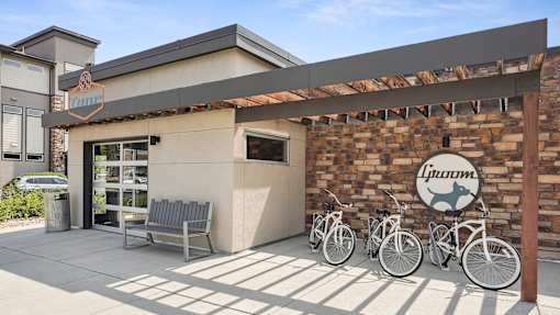 a building with three bikes parked outside of it