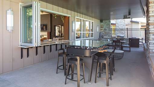 A patio with a table and chairs is shown.