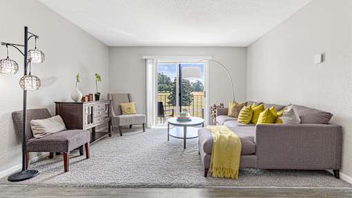 a living room with a couch and a chair