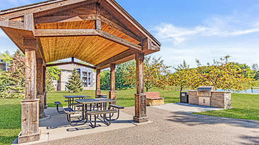 the pavilion at the reserve at city center boasts a picnic table and a grill