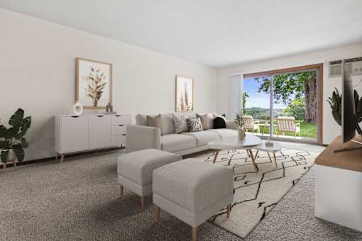 A living room with a grey rug and a white sofa.