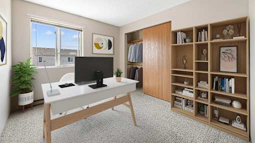 a home office with a white desk and a large window