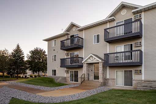 Private patios overlooking walkable spaces outside the property
