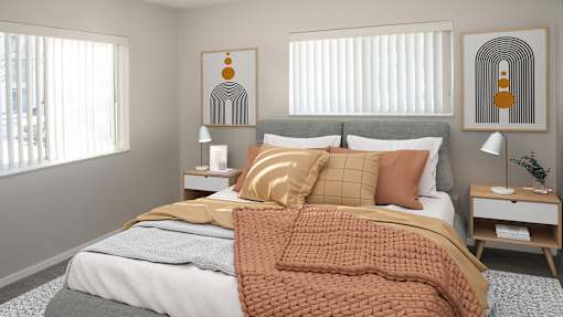 a bedroom with a bed and two windows