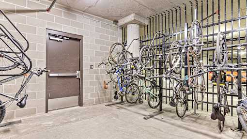 a rack of bikes in a building with a door