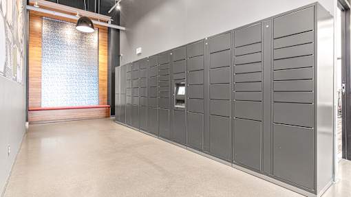 a row of lockers in a room with a brick wall