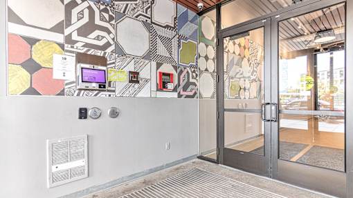 a mural on the wall of a building with a glass door