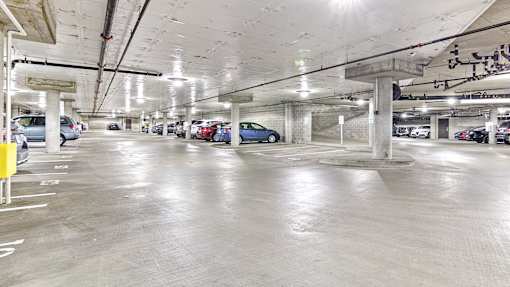 a parking garage with cars parked in it