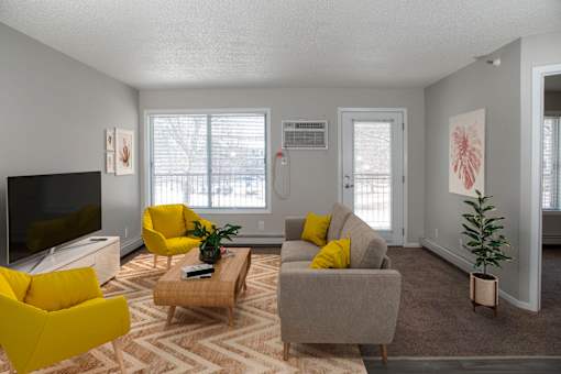 Bright and airy living space that leads out to your private patio or balcony. Living area has large window next to patio door as well.