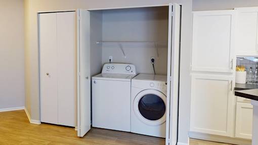 a white washer and dryer in a laundry room