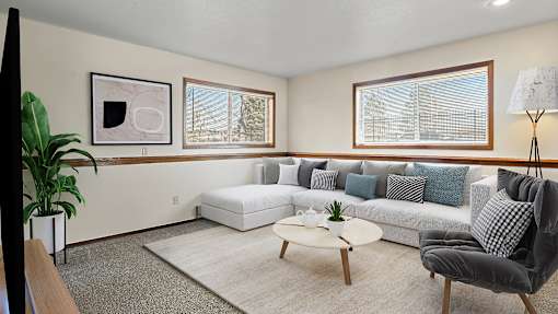a living room with a couch and a coffee table