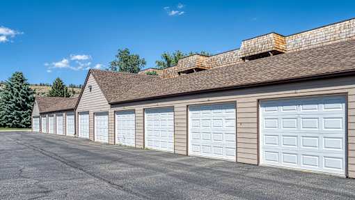 a row of garage doors on the side of a building