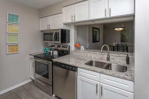 Kitchen Nook with Appliances, White Cabinets and Granite Counter Tops