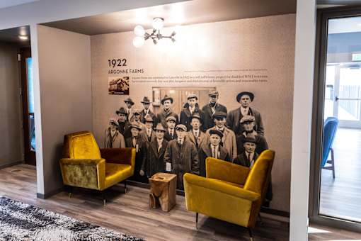 Lobby Nook with Chairs and Historic Mural on Wall