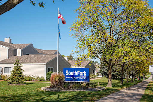 Exterior SouthFork Entrance with Sign and Flagpole