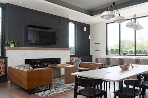 A modern living room with a fireplace and a television.