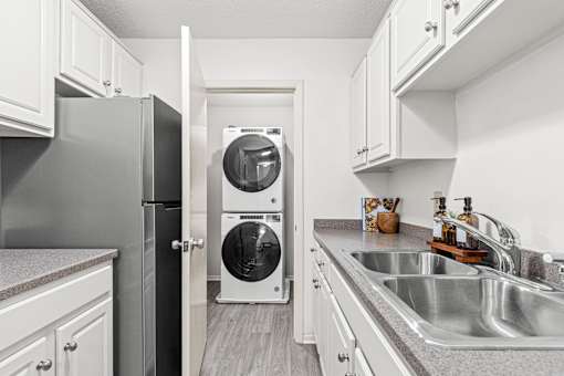Kitchen and Laundry room View at The Bosk Apartment Homes, Woodbury, MN