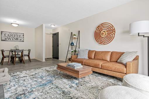 Living Room with Brown Couch at The Bosk Apartment Homes, Woodbury, Minnesota