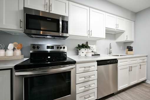 Kitchen with white cabinets and stainless steel appliances