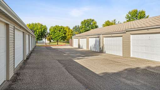 A long row of garage doors are closed.