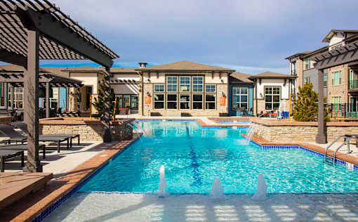 Outdoor Swimming Pool with Splash Jets and Pergolas